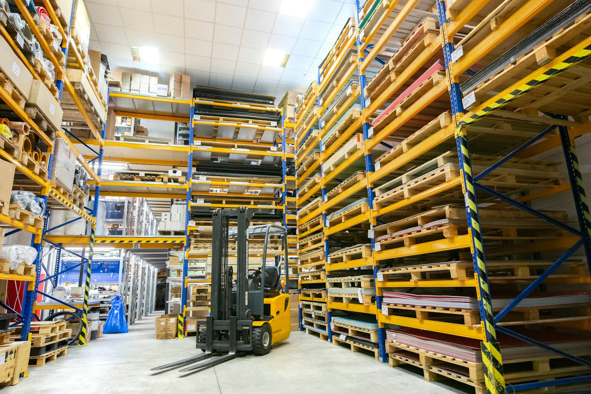 Warehouse aisles stacked with pallets